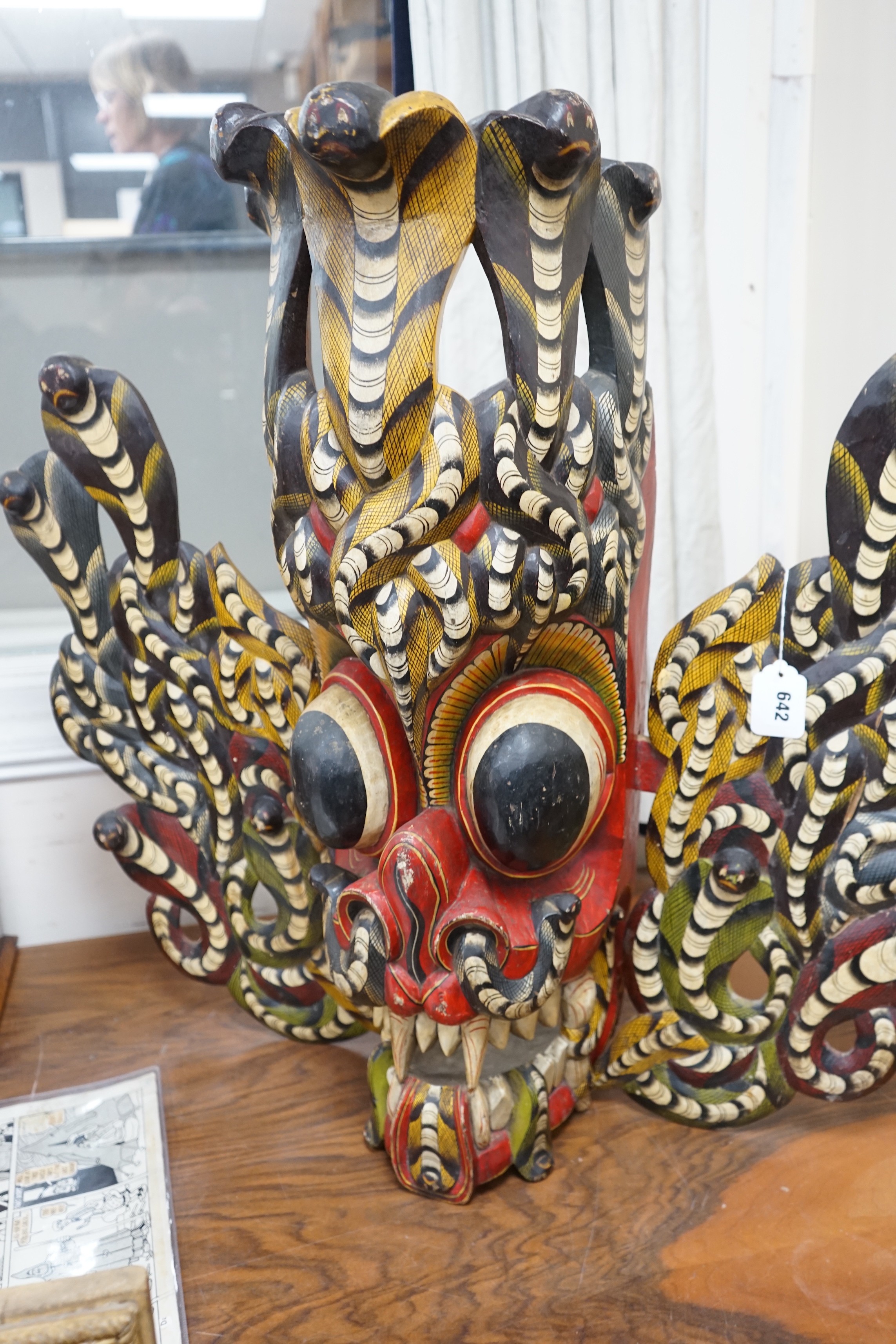 A large interesting Sri-Lankan painted wood Naga Raksha mask, early 20th century, 77cm tall